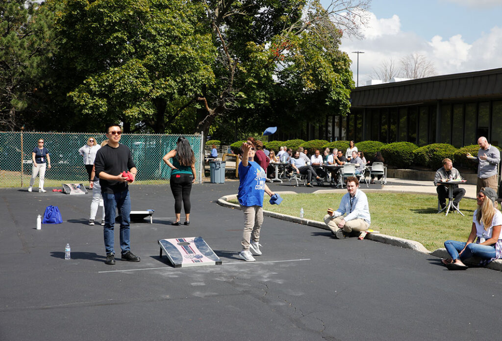 GTI Energy employees participating in the annual bags or corn toss tournament at the GTI Energy headquarters