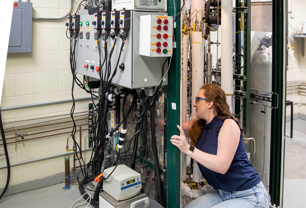 GTI Energy employee who is part of our Engineering Rotational Development Program (ERDP) working in a lab