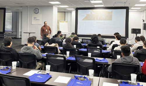 group of employees sitting at tables for a training session in the Eddie Johnston Center (EJC) at GTI Energy headquarters