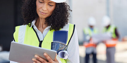 Female Engineer Looking At Tablet 425x283