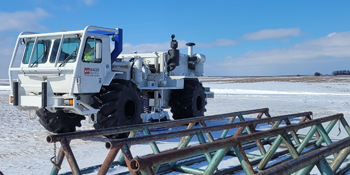 Sub Surface Scan Truck next to metal scaffolding